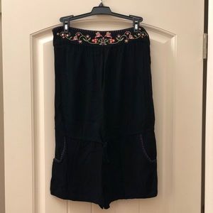 Black romper with floral detail